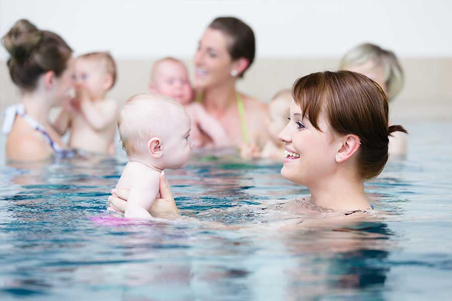 Mother and baby swimming