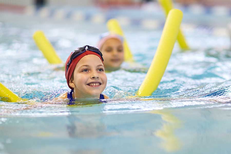 Girl Swimming with Inflatable