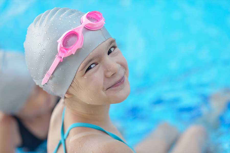 Young Girl Swimmer with Pink Goggles
